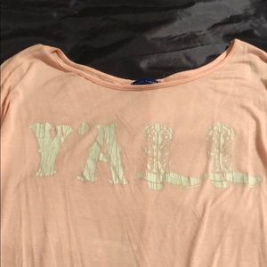 Light Pink long sleeve top.  YA’LL Print on front